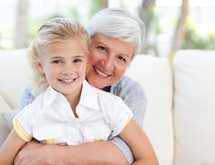 older woman with young girl sitting on lap I dentist in moline il
