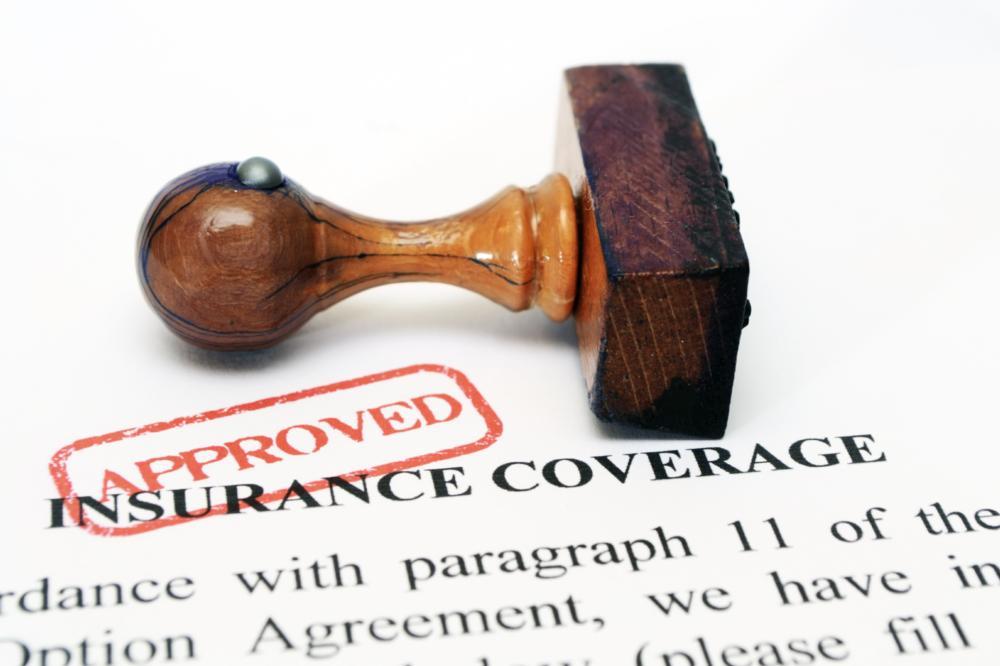 Image of a stamp of approval on insurance papers | Dentist Office in Moline IL