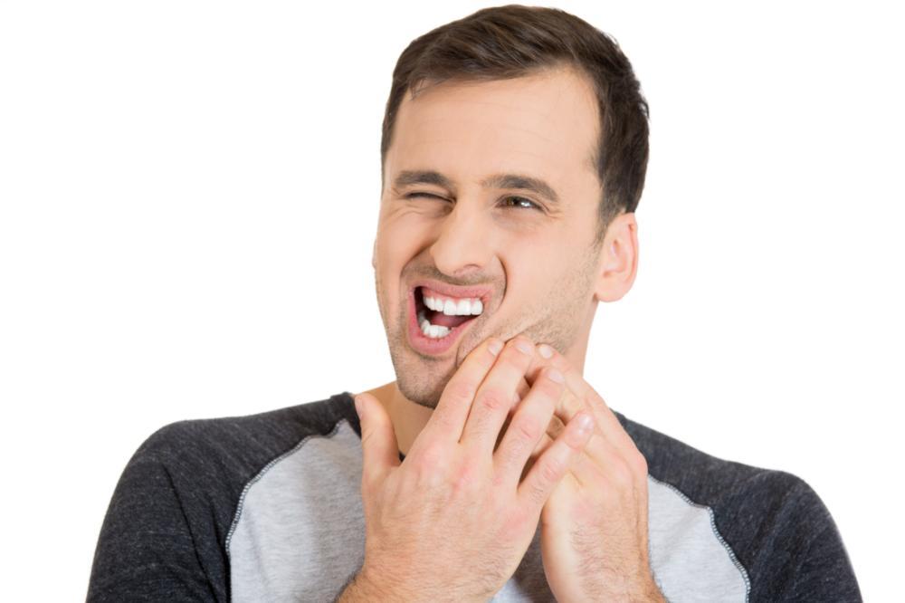 Man with jaw pain | TMJ Treatment Moline IL