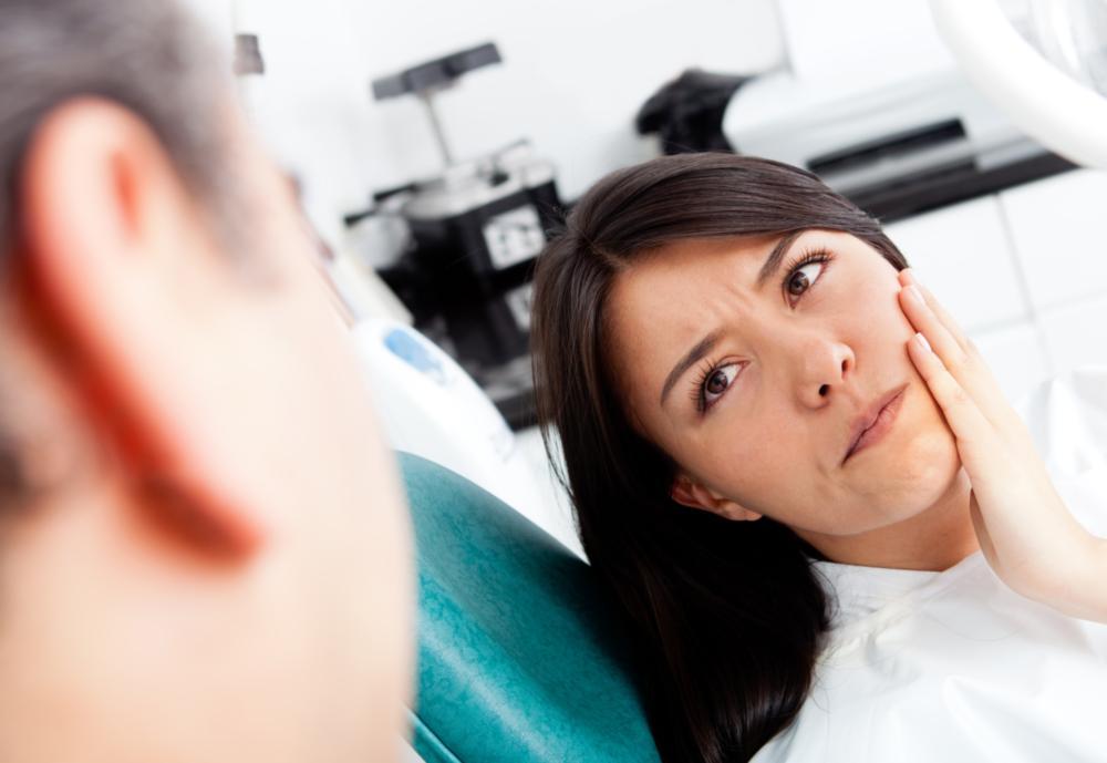 Woman with tooth pain | Root Canals Moline IL