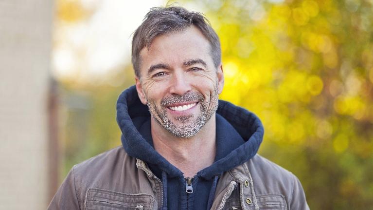 Man smiling outside | CEREC Dental Crowns Moline IL